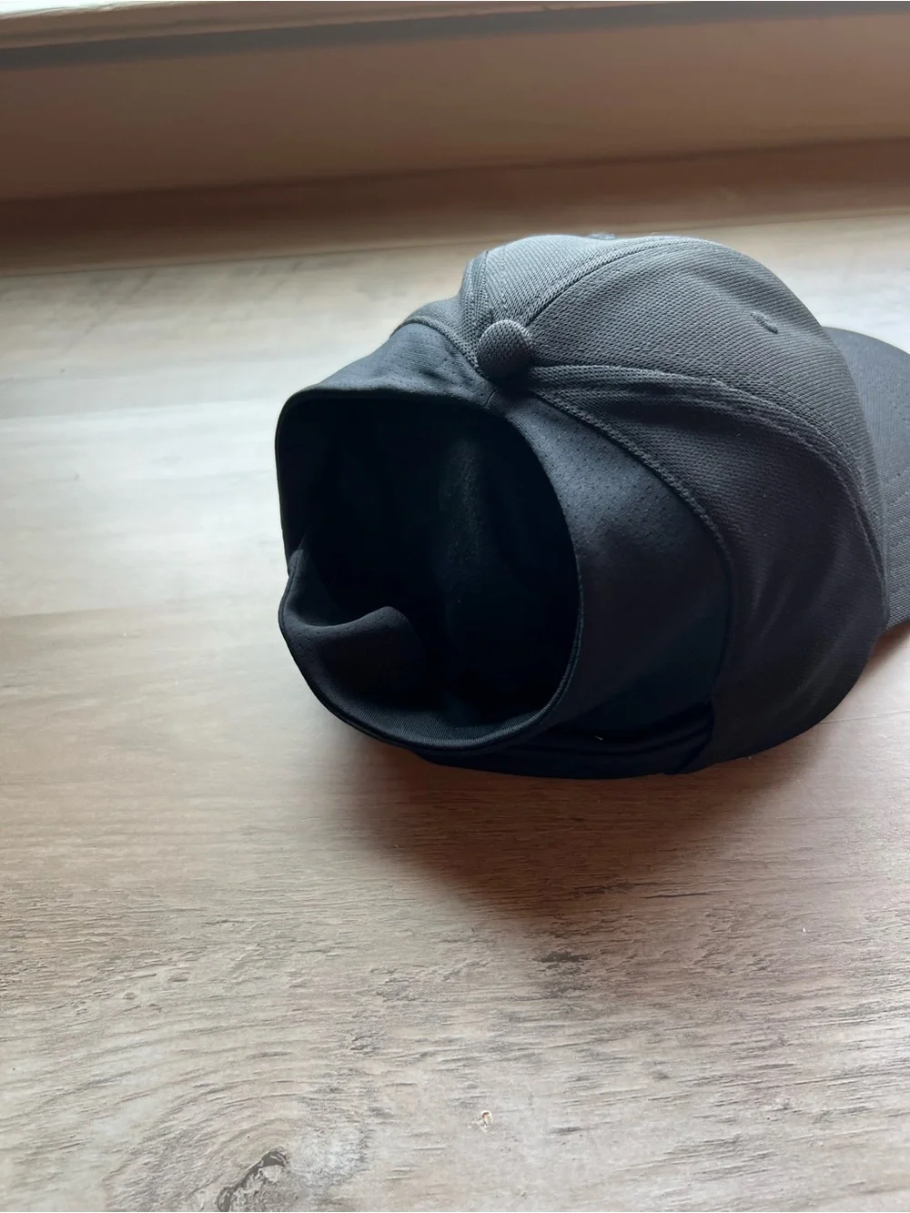 Ladies Under Armour Ponytail Black Cap with White Embroidered Logo